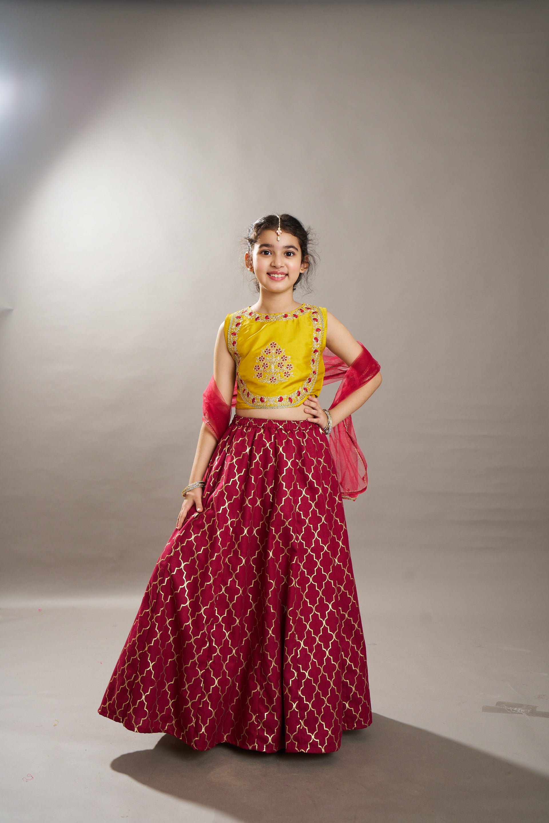 girls maroon yellow foil print with embroidered yoke choli lehenga with dupatta
