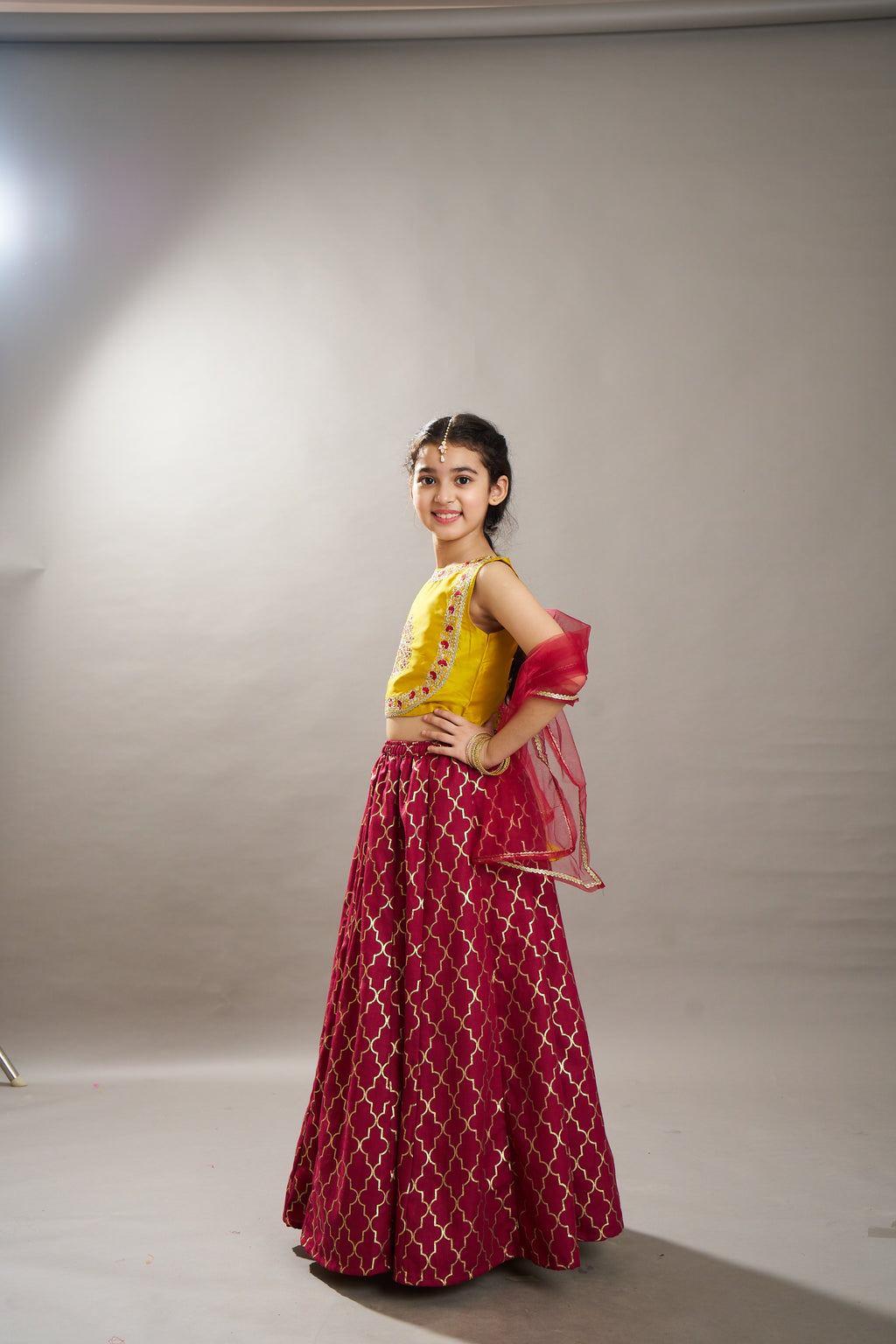 girls maroon yellow foil print with embroidered yoke choli lehenga with dupatta